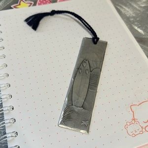 One Wendall August hand made hammered aluminum bookmark